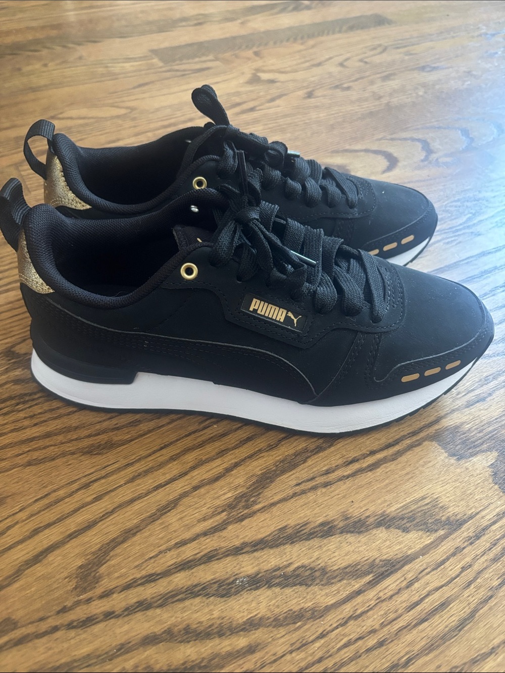 NWOT never worn Puma Black & Gold Casual Low-Top Sneakers